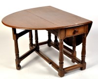 Lot 1122 - An 18th Century and later oak drop leaf table,...