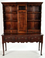 Lot 1137 - An 18th Century style oak dresser, the raised...