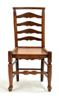 Lot 1141 - A 19th Century elm dining chair, the shaped...