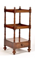 Lot 1142 - An early Victorian mahogany three-tier whatnot,...