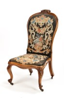 Lot 1146 - A Victorian walnut nursing chair, with carved...