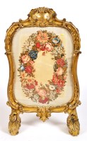 Lot 1151 - A 19th Century French giltwood firescreen, the...