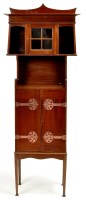 Lot 1179 - An Arts & Crafts mahogany cabinet of oriental...