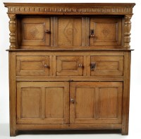 Lot 1181 - A light oak court cupboard, the flared cornice...