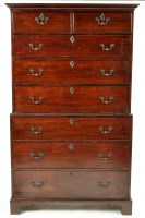 Lot 1183 - A George III mahogany tallboy, the flared...