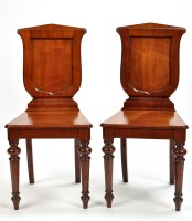 Lot 1198 - A pair of Victorian mahogany hall chairs, the...