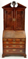 Lot 1208 - A George III mahogany bureau cabinet,...