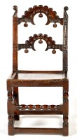 Lot 1213 - A Yorkshire oak hall chair, with double...