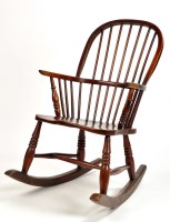 Lot 1233 - A 19th Century elm Windsor rocking chair, the...