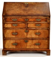 Lot 1256 - A George II walnut crossbanded bureau, the...