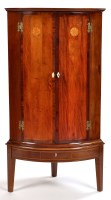 Lot 1257 - An early 19th Century mahogany bowfront corner...