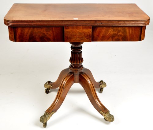 Lot 1258 - A Regency style mahogany turnover swivel top...