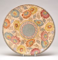 Lot 21 - Charlotte Rhead, Bursley Ware: a charger with...