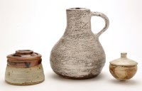 Lot 56 - A stoneware jug, with cream and speckled brown...
