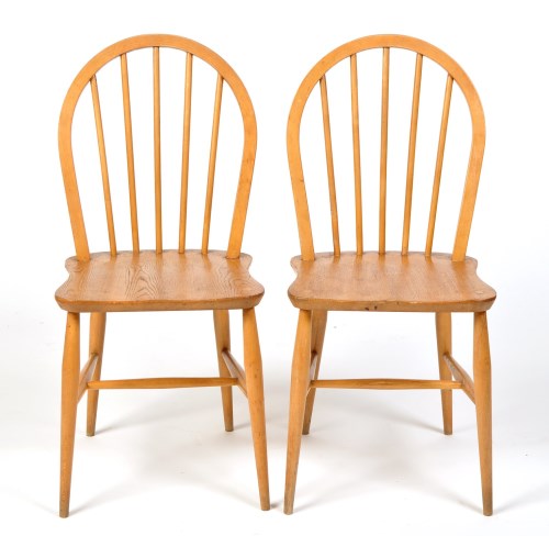 Lot 95 - Two Ercol beech wood dining chairs, stamped...