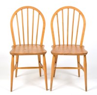 Lot 95A - Two Ercol beech wood dining chairs, stamped...