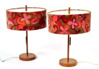 Lot 106 - A pair of teak table lamps with pull cord and...