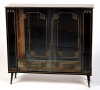 Lot 107 - A 1950's display cabinet, shaped rectangular...
