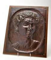 Lot 164 - A copper relief plaque depicting the head of a...