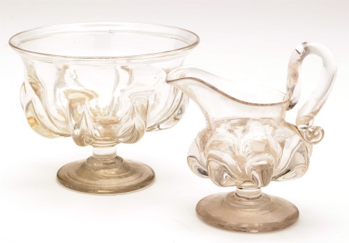 Lot 275 - An 18th Century jug and bowl, with gadrooned...