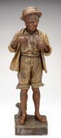 Lot 312 - Goldscheider: a painted terracotta figure of a...