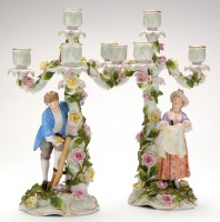 Lot 337 - A pair of Dresden style candelabra, a male and...