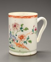 Lot 381 - A Famille Rose tankard, decorated with peonies...