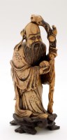 Lot 398 - A carved soapstone figure of Shoulau,...