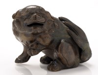 Lot 401 - A bronze recumbent lion-dog, probably 18th...