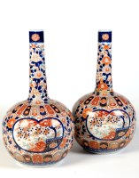 Lot 411 - A large pair of Imari bottles, typically...