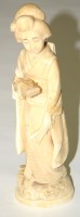 Lot 413 - A Japanese carved ivory okimono, Meji period,...