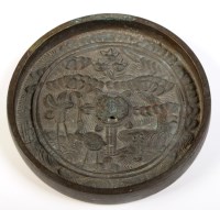 Lot 426 - A bronze mirror, probably Edo period, the back...