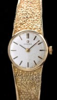 Lot 601 - Omega: a lady's 9ct. gold cased cocktail watch,...