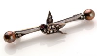 Lot 652 - A Victorian bird pattern bar brooch, the...