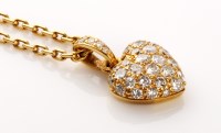 Lot 654 - Cartier: a diamond set heart pattern pendant,...