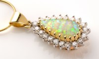 Lot 662 - An opal and diamond cluster pendant, the...