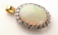 Lot 664 - An opal and diamond pendant, the central oval...