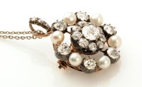 Lot 667 - A diamond and pearl cluster brooch/pendant,...