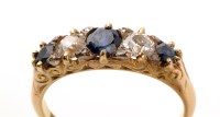 Lot 669 - A sapphire and diamond ring, the three...