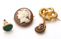 Lot 690 - A carved shell cameo brooch, the roundel...