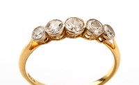 Lot 693 - A five stone diamond ring, the tapering old...