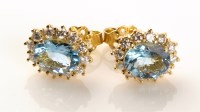 Lot 696 - A pair of aquamarine and diamond cluster...