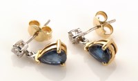 Lot 697 - A pair of sapphire and diamond earrings, each...