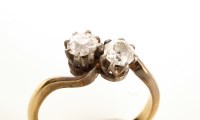 Lot 711 - A two stone diamond ring, each diamond...