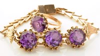 Lot 723 - An Egyptian amethyst bracelet, the three...