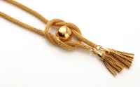 Lot 738 - A yellow metal granny-knot pattern necklace,...