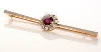 Lot 746 - A ruby and diamond cluster bar brooch, the...