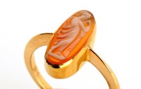 Lot 757 - A cameo ring, the hard stone matrix carved...