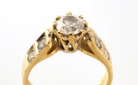 Lot 762 - A diamond ring, the central brilliant cut...