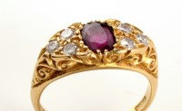 Lot 772 - A ruby and diamond ring, the central oval...